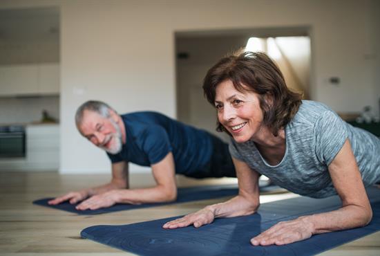 senior-couple-exercise-indoors